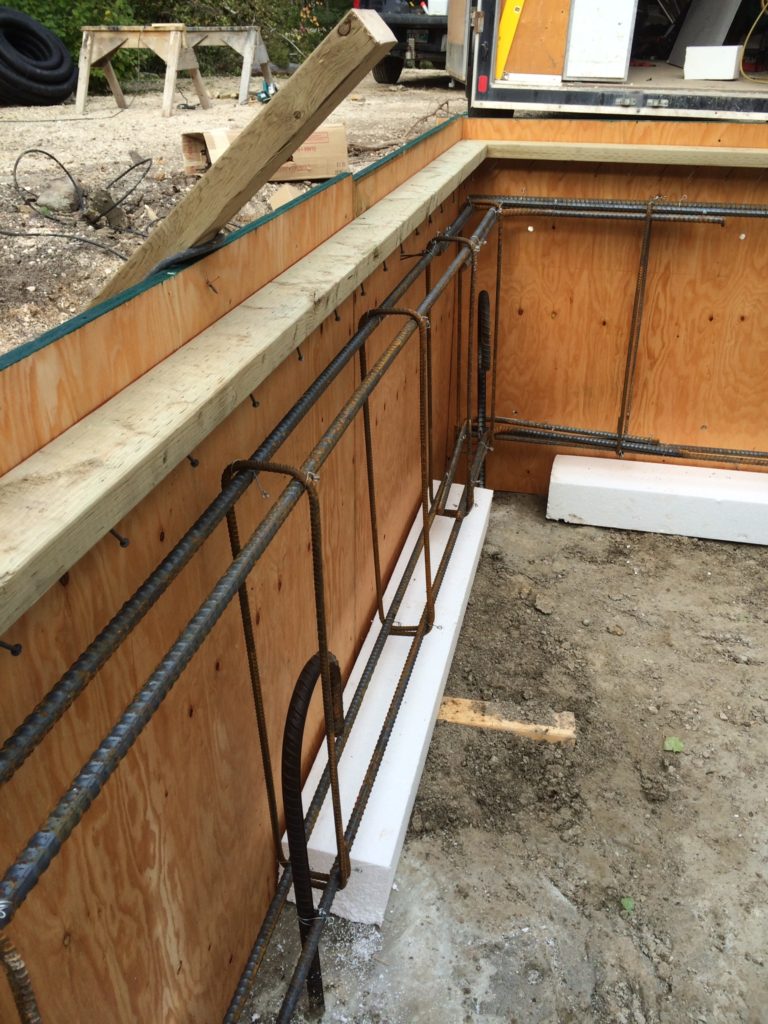 Inside of a foundation wall on piles