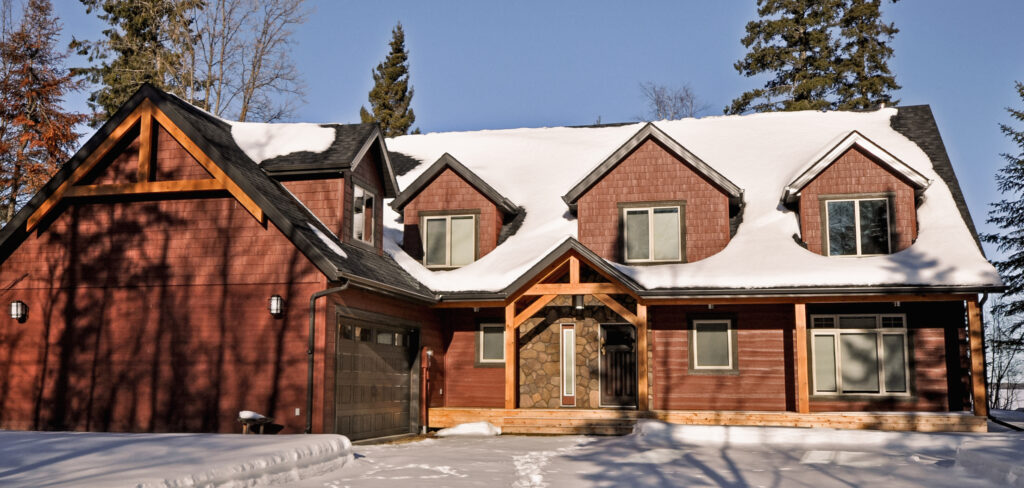 Custom Home Covered in Snow in Winter